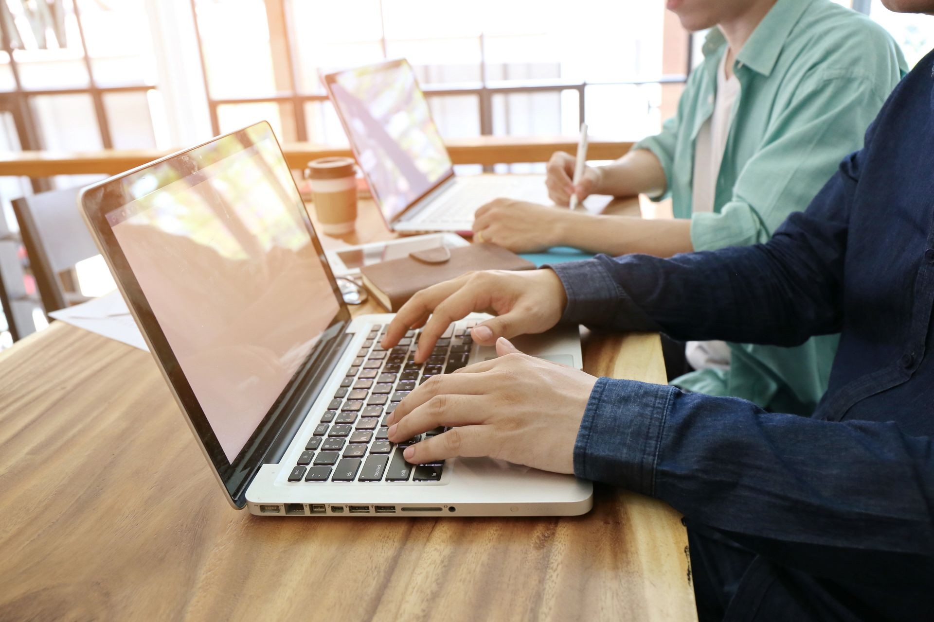 Hand multitasking man working on laptop and phone connecting wifi internet. Business People Meeting Conference Discussion Corporate Concept. Trading Online Public Relations Director Analyze Reports